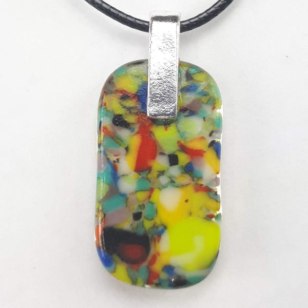 Back of coloured rectangular glass pendant on white background